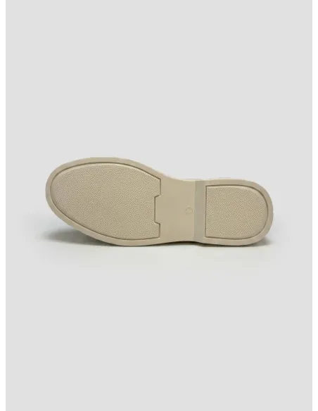 Green loafer with white sole
